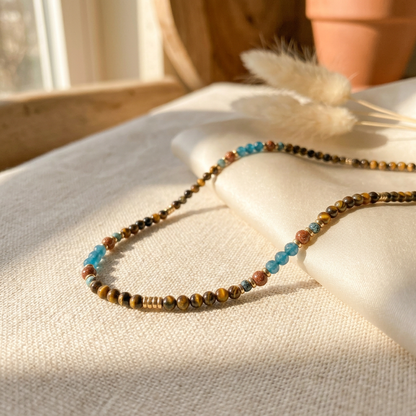 Close-up of the hypoallergenic 18K gold-plated lobster clasp and adjustable extender on the handmade Terra Aura necklace.