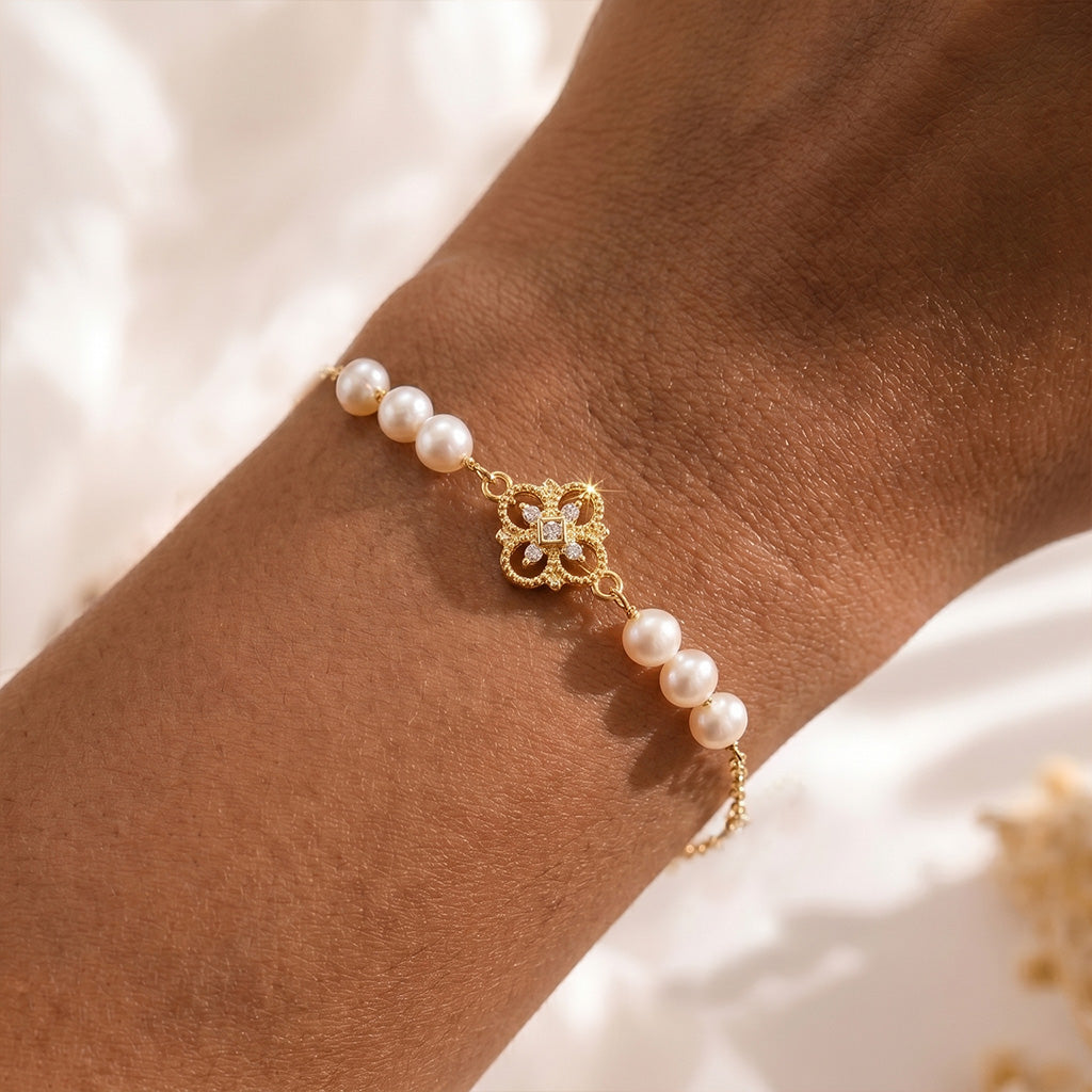 18K gold plated and natural freshwater pearl Aurelia bracelet glowing elegantly against the skin.