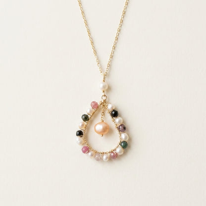 Necklace with multicolored beads on a light background