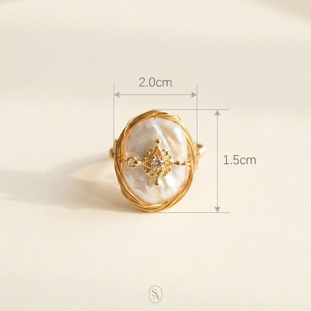 Sizing guide for The 'Aurelia' baroque pearl ring, showing approximate dimensions of the pearl and the 14K gold plated adjustable band.