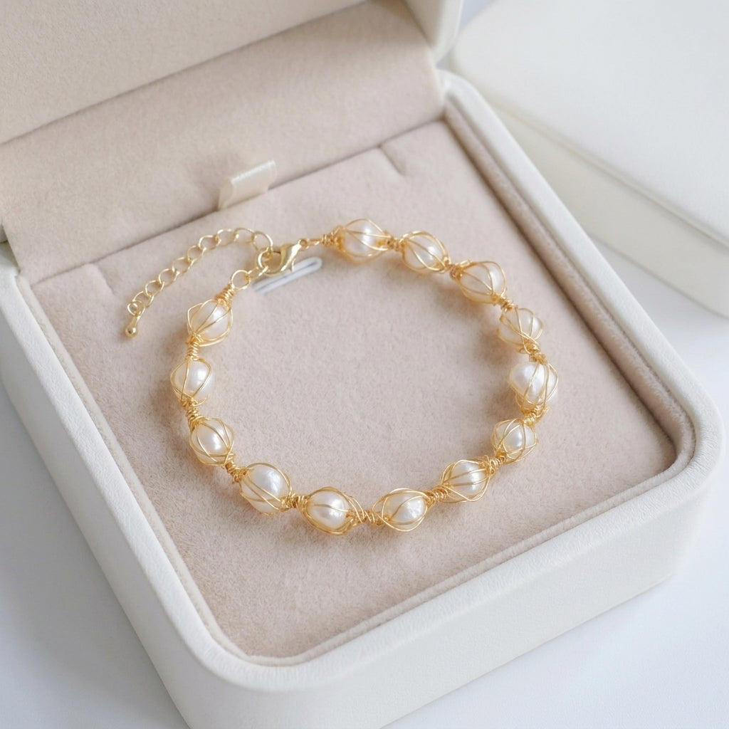 The pearl and gold bracelet presented in a Whisperland Studio gift box