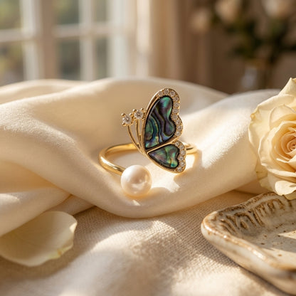Top view of 14K gold plated butterfly ring featuring iridescent abalone shell and pearl
