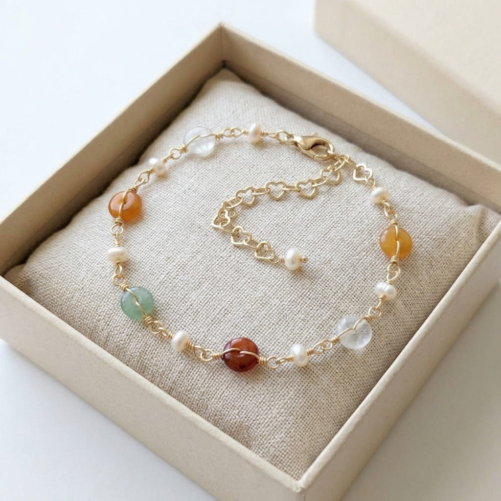 The Elara dainty gemstone bracelet beautifully packaged inside an elegant beige Whisperland Studio jewelry gift box.