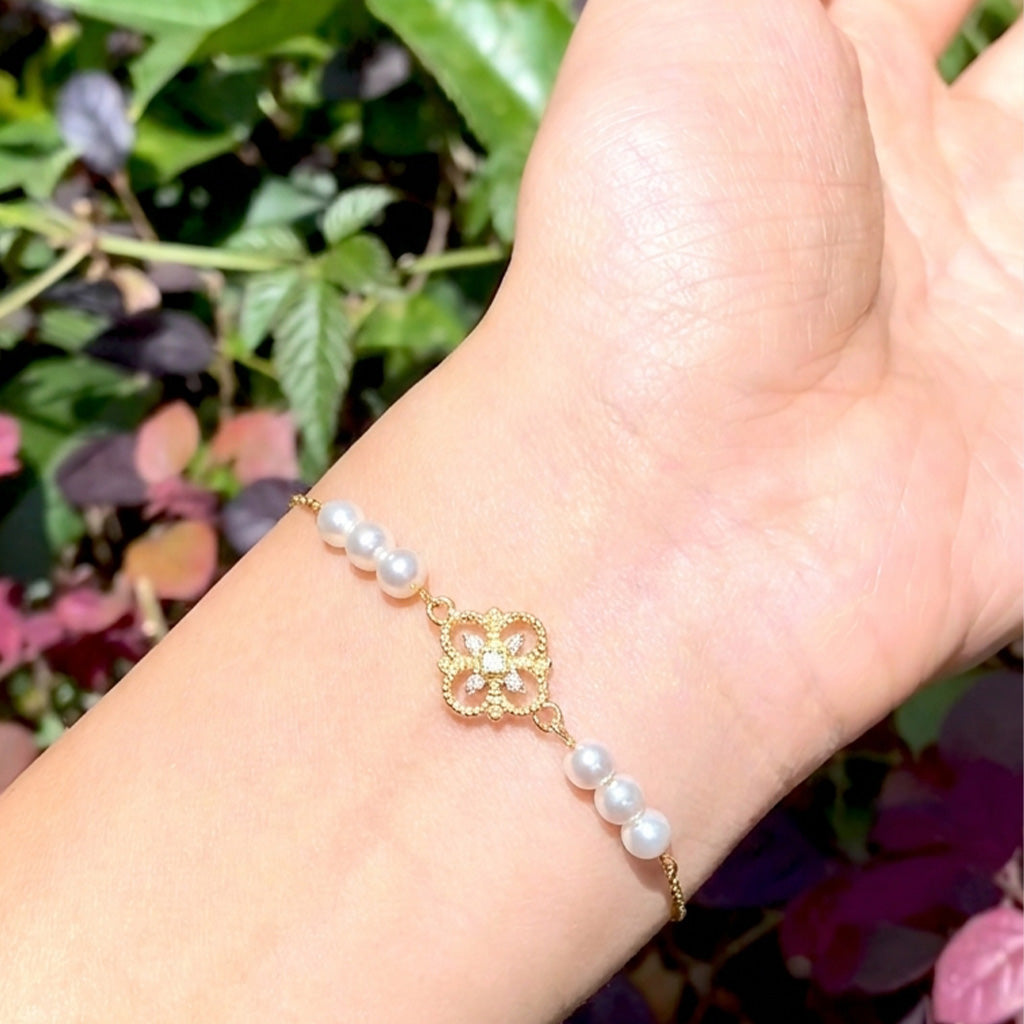 Elegant everyday styling of the Aurelia 18K gold plated vintage pearl charm bracelet by Whisperland Studio.