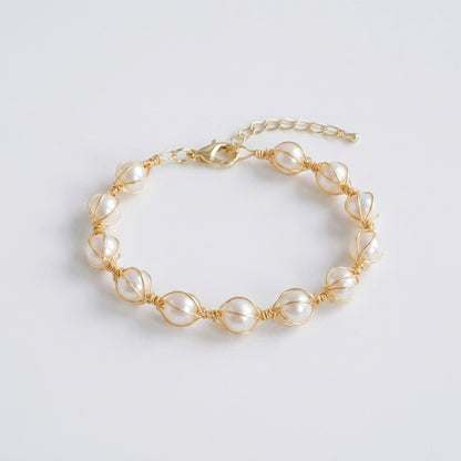 Close-up shot of the natural freshwater pearls and tiny gold beads on the bracelet