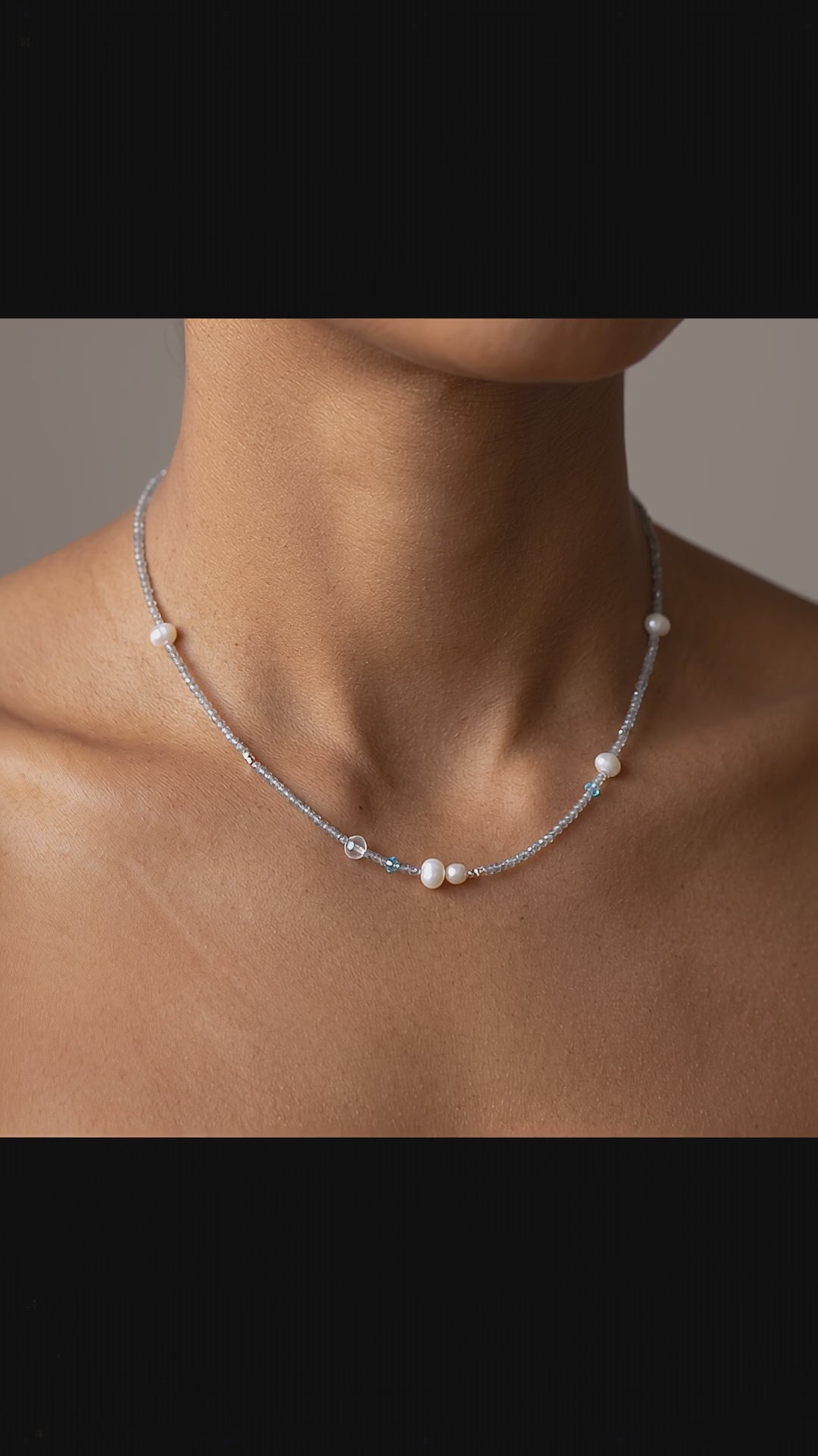 Model wearing the Aetheris Lunar Dew dainty silver choker featuring freshwater pearls and aquamarine by Whisperland Studio