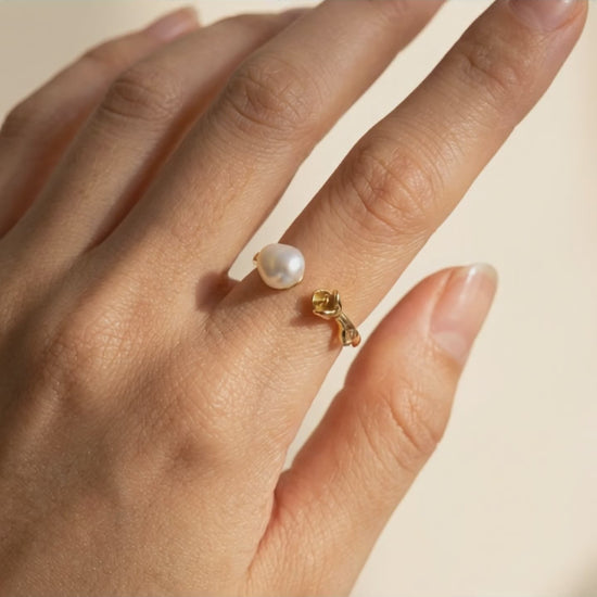 Video showcase of The 'Rosalie' baroque pearl rose ring, displaying its fully adjustable 14K gold-plated band and natural pearl luster from all angles by Whisperland Studio.