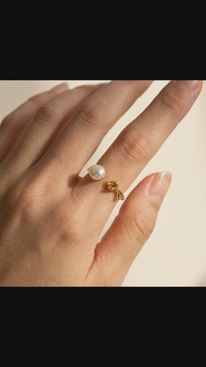 Video showcase of The 'Rosalie' baroque pearl rose ring, displaying its fully adjustable 14K gold-plated band and natural pearl luster from all angles by Whisperland Studio.