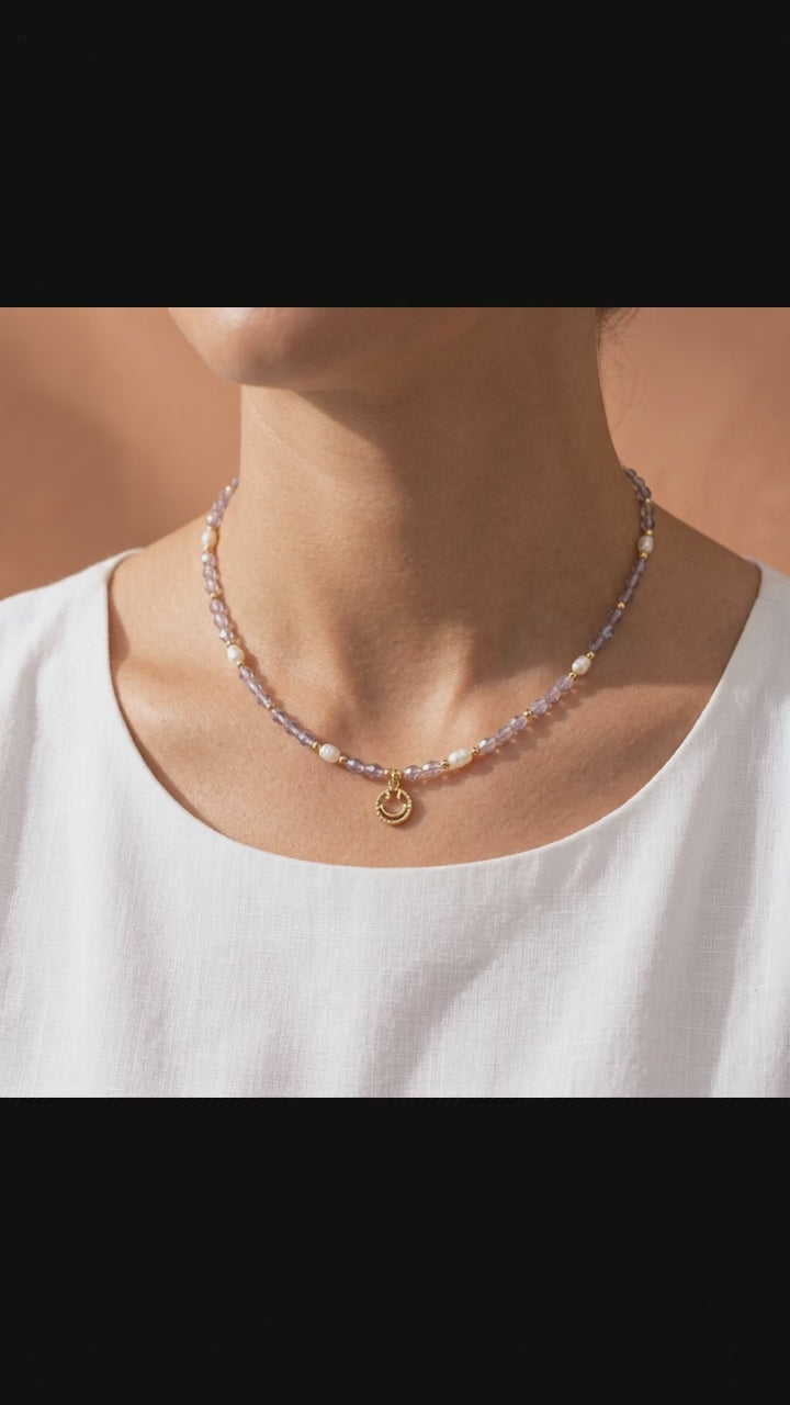 Video showcasing the 360-degree view, natural pearl luster, and cheerful gold smiley face detail of the 'Serotonin' dainty necklace.