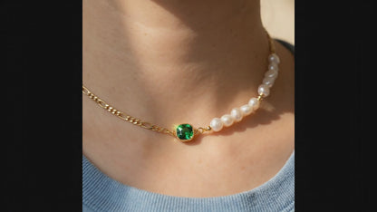 ASMR video showcase of the “Verdant Muse” Emerald and Pearl Choker featuring the 14K gold figaro chain and natural gemstone shimmer