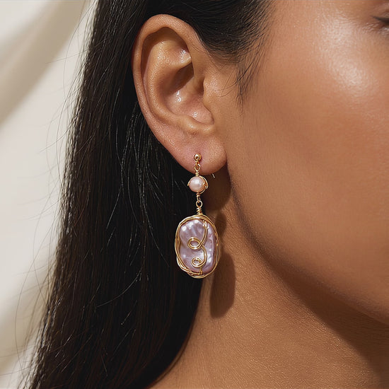 Video showcase highlighting the natural shimmer, iridescent colors, and elegant movement of the Twilight Reverie dangle earrings.