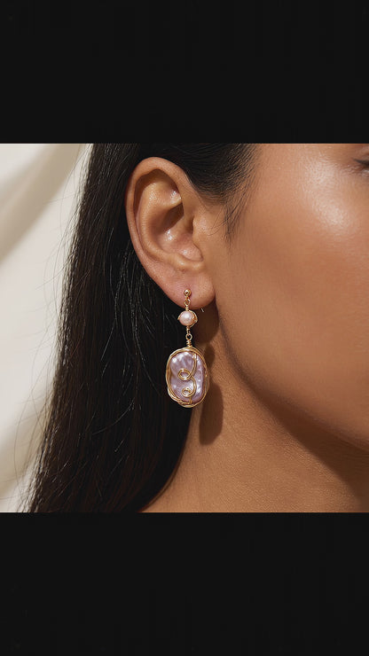 Video showcase highlighting the natural shimmer, iridescent colors, and elegant movement of the Twilight Reverie dangle earrings.