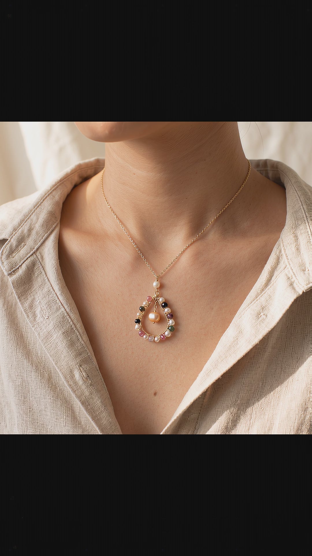 Video showcasing the delicate movement, natural stone colors, and light handmade details of the Pastel Dewdrop necklace.