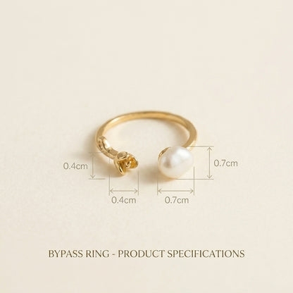 Clear product shot of The 'Rosalie' adjustable open band ring, featuring a 14K gold rose and a genuine unique baroque pearl.