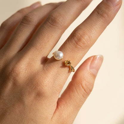 Close-up of The 'Rosalie' 14K gold plated baroque pearl rose ring worn on a finger, showcasing its dainty coquette aesthetic by Whisperland Studio.