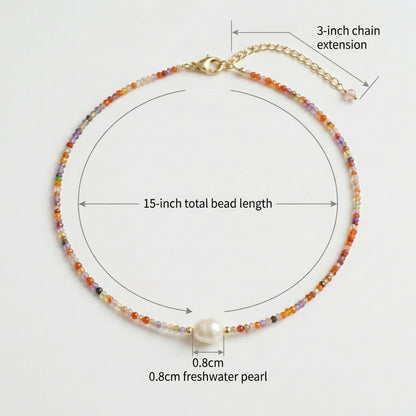 Size guide and measurements for the Sunrise Whisper beaded necklace, showing a 15-inch bead length, 3-inch chain extension, and a 0.8cm central freshwater pearl by Whisperland Studio.