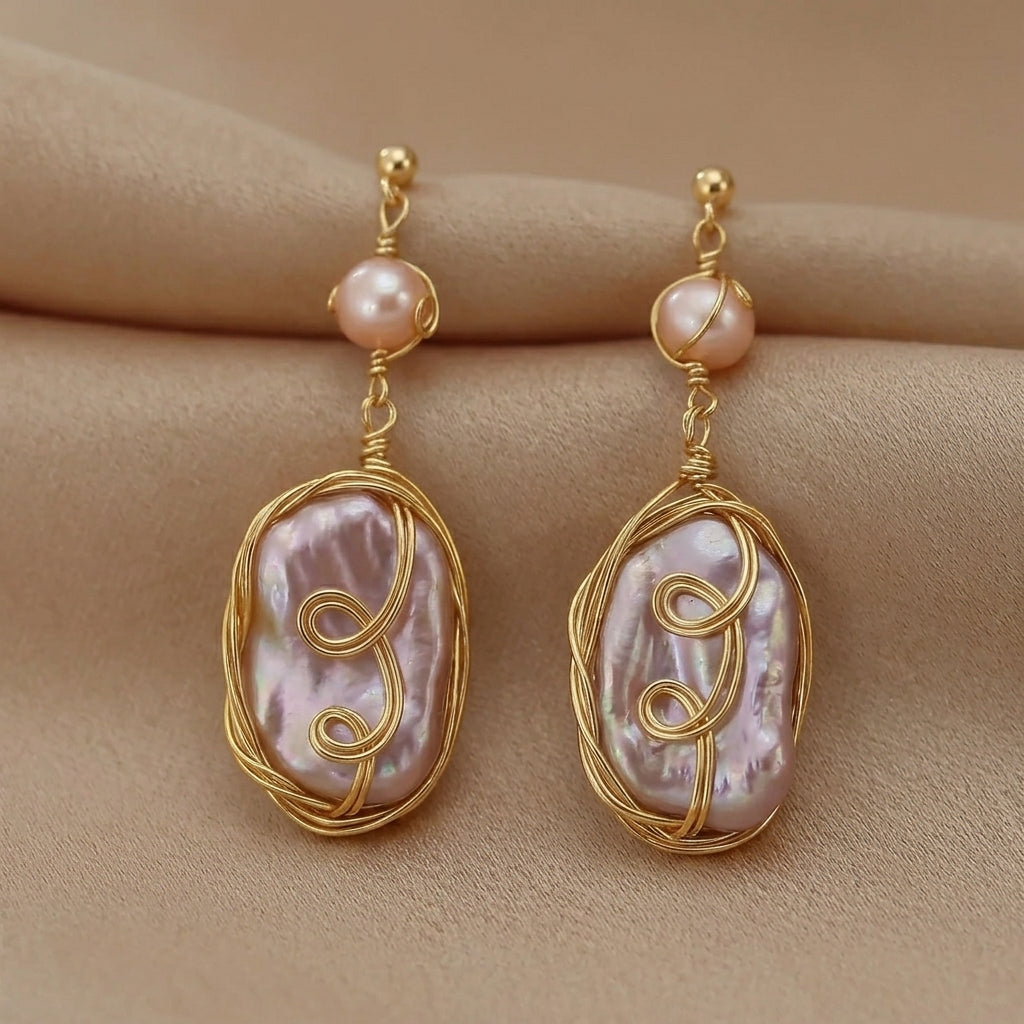 Handmade baroque pearl statement earrings elegantly displayed on a minimalist prop by Whisperland Studio.