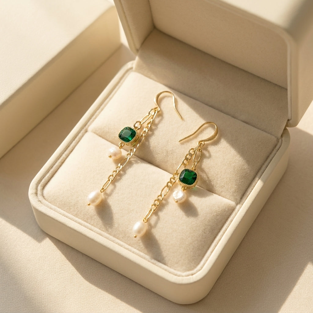 “Verdant Muse” Emerald and Freshwater Pearl Drop Earrings presented in a premium cream jewelry gift box